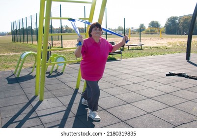 Grandmother regularly plays outdoor sports and is doing great in her seventy years, an active lifestyle, and regular workouts keep her in good shape. - Shutterstock ID 2180319835