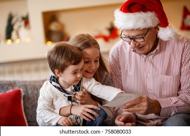 Grandpa With Grandchildren Looking Christmas Photo