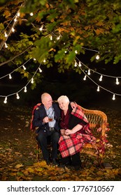 Grandpa And Grandma Drink Tea In The Park.