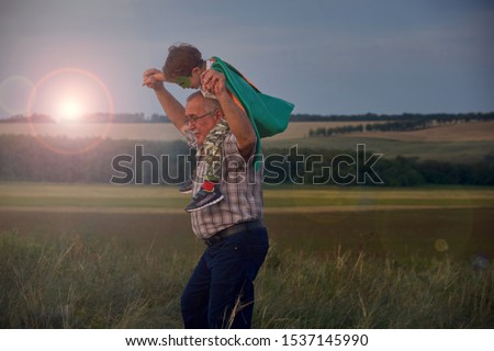 grandpa holding grandson. Family Relationship Between Grandfather and Grandson. Grandpa Teaching,