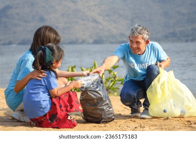 grandpa volunteer holds plastic bottle teach children to separate garbage at sand beach,collect and separate plastic bottle for reuse,concept of environmental conservation,campaign, awareness,support  - Powered by Shutterstock