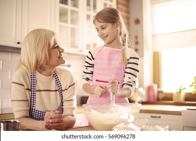 Grandparent And Grandchild Baking Together 