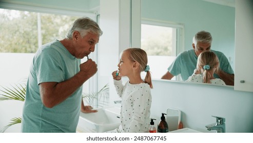 Grandparent, kid and brushing teeth in bathroom for care, dental health and learning oral hygiene. Child, grandfather and girl with toothbrush for cleaning, wellness or morning routine in family home - Powered by Shutterstock