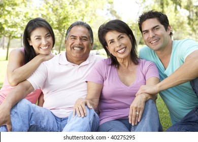 Grandparents With Adult Children In Park