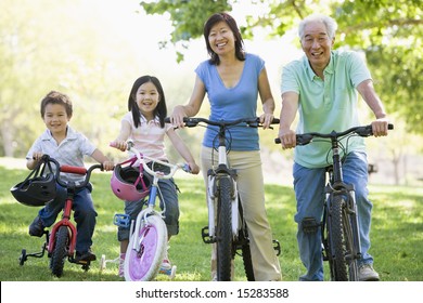 Grandparents bike riding with grandchildren.