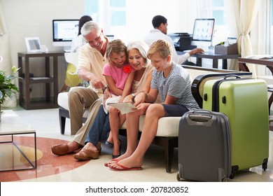 Grandparents With Grandchildren Arriving In Hotel Lobby - Powered by Shutterstock