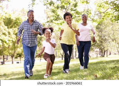 Grandparents And Grandchildren In Park