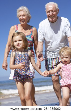 Similar – Little girl running with women on beach