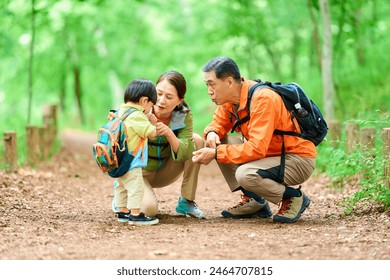 Grandparents hydrating their 2-year-old grandson - Powered by Shutterstock