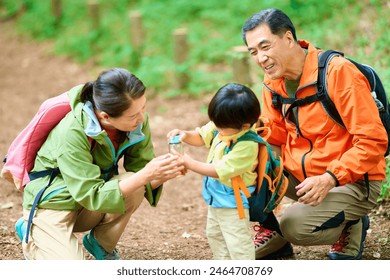 Grandparents hydrating their 2-year-old grandson - Powered by Shutterstock