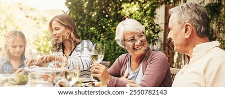 Two women enjoying a leisurely afternoon with wine outdoors