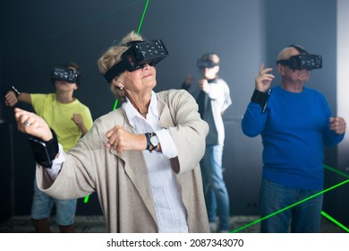 Grandparents Playing Games With Their Young Grandkids In VR Club.