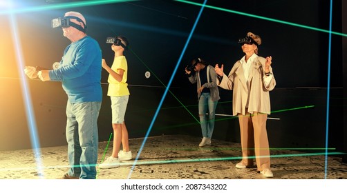 Grandparents Playing Games With Their Young Grandkids In VR Club.