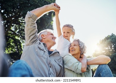 Grandparents Playing Together With A Girl In The Park In The Morning. Family, Love And Grandchild Bonding With Grandmother And Grandmother In A Garden. Child Holding Hands With Senior Couple Outside