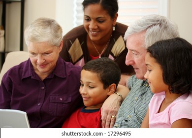 Grandparents together with their family at home