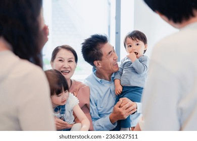 Grandparents are visiting their grandchildren at home - Powered by Shutterstock