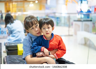 Grandson Is Crying, He Want To Buy Toys At The Department Store. Grandma Try To Teach Her Grandson To Understand Why She Can Not Buy Its.