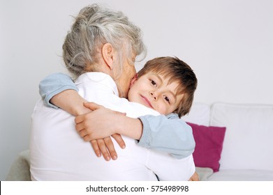 Grandson Is Giving His Grandmother A Big Hug