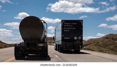 Granger, Wyoming, USA, May 10, 2021 Two Semi Trucks On US 30 Near Granger, Wyoming