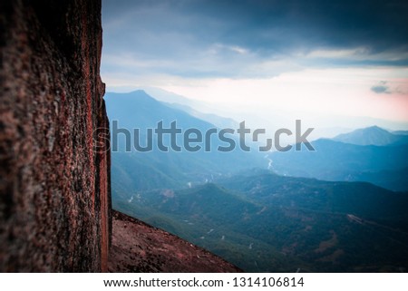 Granit rock on Moro Rock hiking track, view to Sequoia and Kings Canyon National Parks, California, USA. Landscape scenery of giant forests and foggy valleys of Sierra Nevada.