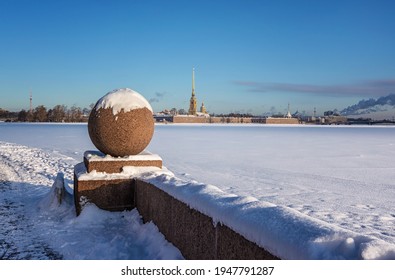 Granite Ball Near The Ice And Snow-covered Neva River On The Spit Of Vasilyevsky Island