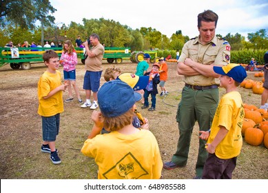 GRANITE BAY, CALIFORNIA, USA - October 18 2009: Cub Scout Leader Talks With Boys In His Den While On A Field Trip To A Pumpkin Farm