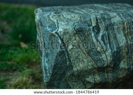 Granite boulder revealing heavy texture and striations