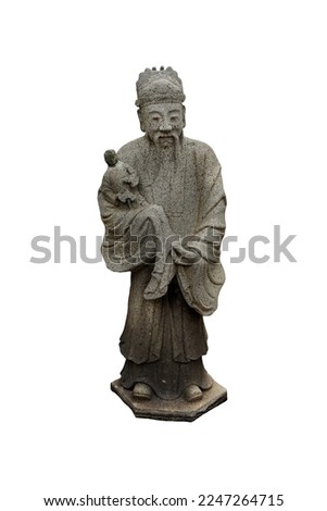 Granite carved antique Chinese philosopher holding a doll sculpture figure isolated on white background. Ancient Stone Chinese woman sculpture in Wat Pho temple in Bangkok, Thailand. 