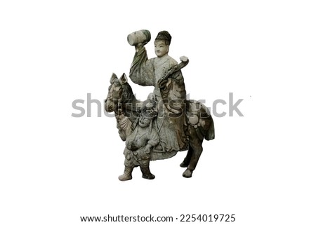 Granite carved antique Chinese 
woman holding a drum on horseback with a steerer isolated on white background. Ancient Stone Chinese woman sculpture in Wat Pho temple in Bangkok, Thailand. 