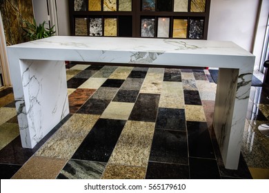 Granite Counter Top With Kitchen Shelves Background