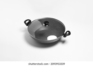 Granite frying pan with glass lid isolated on white background.Cooking pot.High resolution photo.Top view. Mock-up.