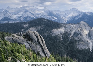 Granite Mountains With Green Valley And Cloudy Sky