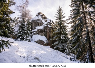 Granite Rock Formation Covered By Snow