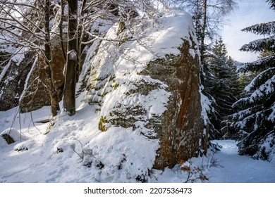 Granite Rock Formation Covered By Snow