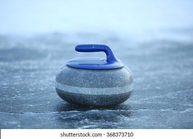 granite stones for curling on ice of frozen lake