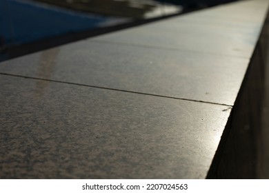 Granite Tiles. Facade Cladding. Details Of Building. Parapet In City.