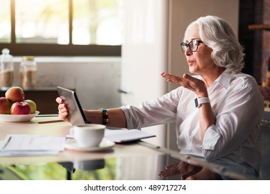 Granny Communicating With Her Family Via Skype