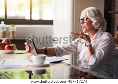 Granny communicating with her family via skype