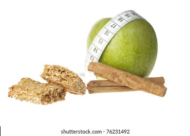 Granny Smith Apple, Cinnamon Sticks And Apple Cinnamon Granola Bar.