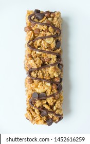 Granola Bar With Cereal And Chocolate On A White Background.