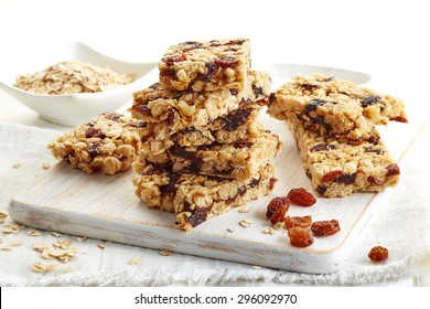 Granola Bar With Raisins On White Wooden Background