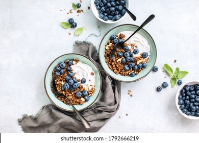 Granola And Blueberry Breakfast With Plain Yogurt, Overhead View Of Table Setting, Healthy Food Concept