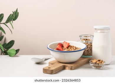 Granola in bowl with strawberries on light background with copy space. Food breakfast background - Powered by Shutterstock