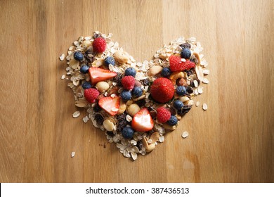 Granola Healthy Snack With Fresh Berry In Heart Shaped