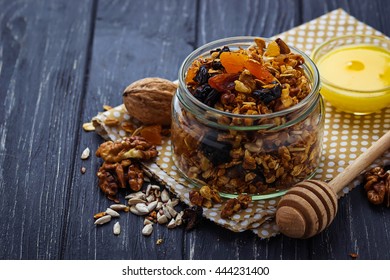 Granola In Jar With Nuts And Dried Fruit. Selective Focus