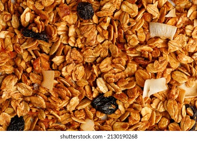 Granola Or Muesli Texture Background With Coconut And Raisin, Close Up, Top View