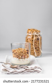 Granola And Yogurt Parfait In A Glass Cup, Oats And Nuts Parfait, Toasted Honey Granola On Top Yogurt In A Glass Cup 