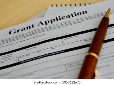 grant application form with pen