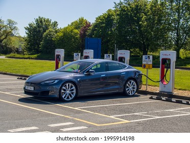 Grantham, UK - May 30th 2021: Tesla Model S Charging At A Motorway Service Station.