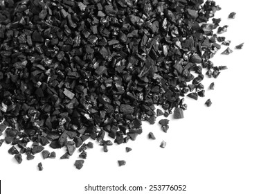 Granular activated carbon for water filter on white background